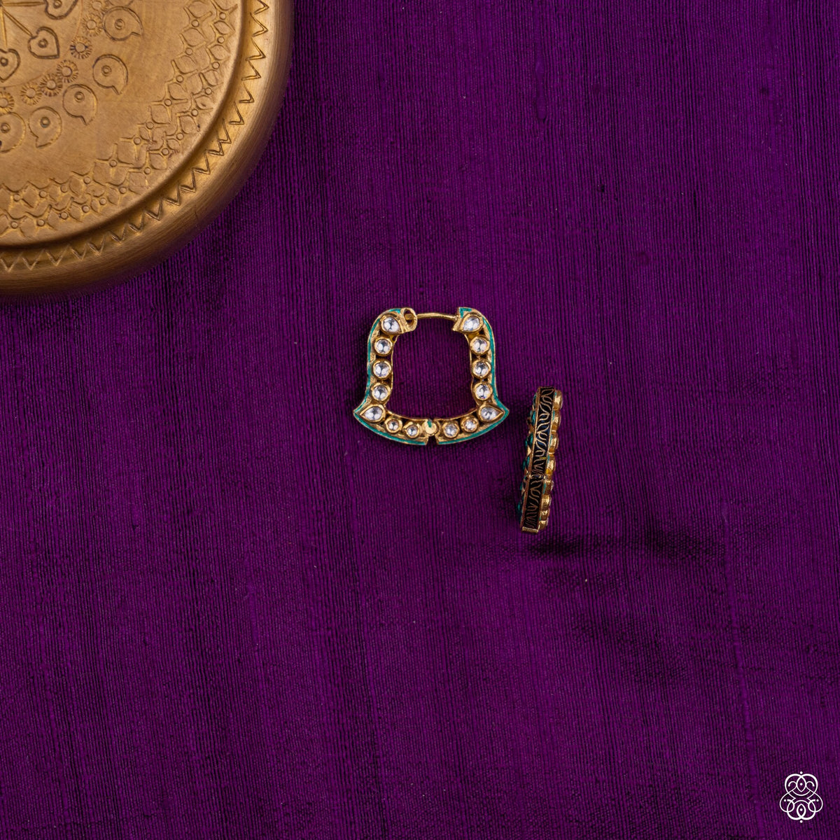 Close view of the white kundan and teal enamel on the Chaukhat square bali earrings