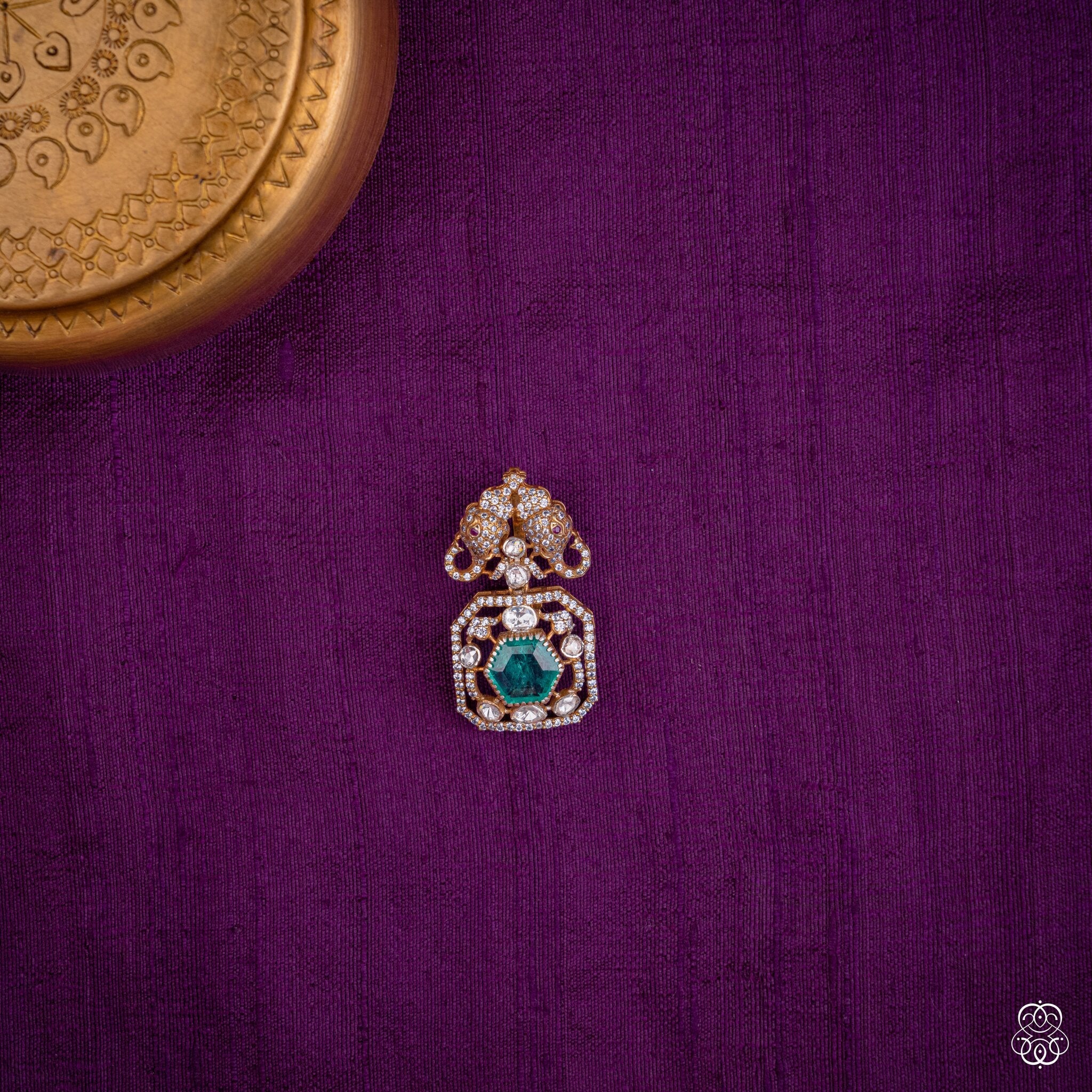 Gajayugma twin elephant pendant with a green lab-grown emerald and moissanites in 92.5 sterling silver with 22k gold plating