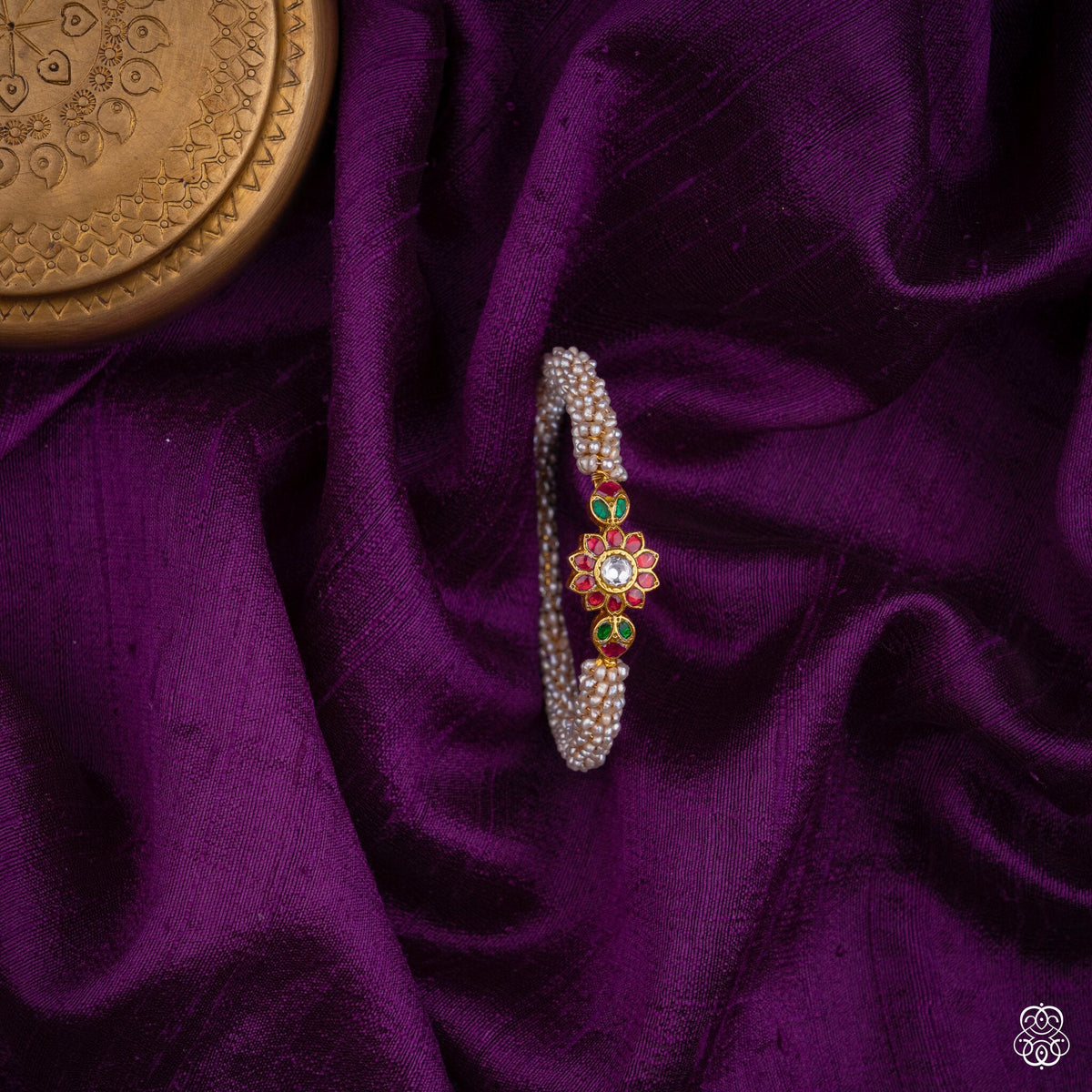 Muktakusuma fresh water pearl bangle with ruby and emerald floral centre in 92.5 sterling silver with 22k gold plating