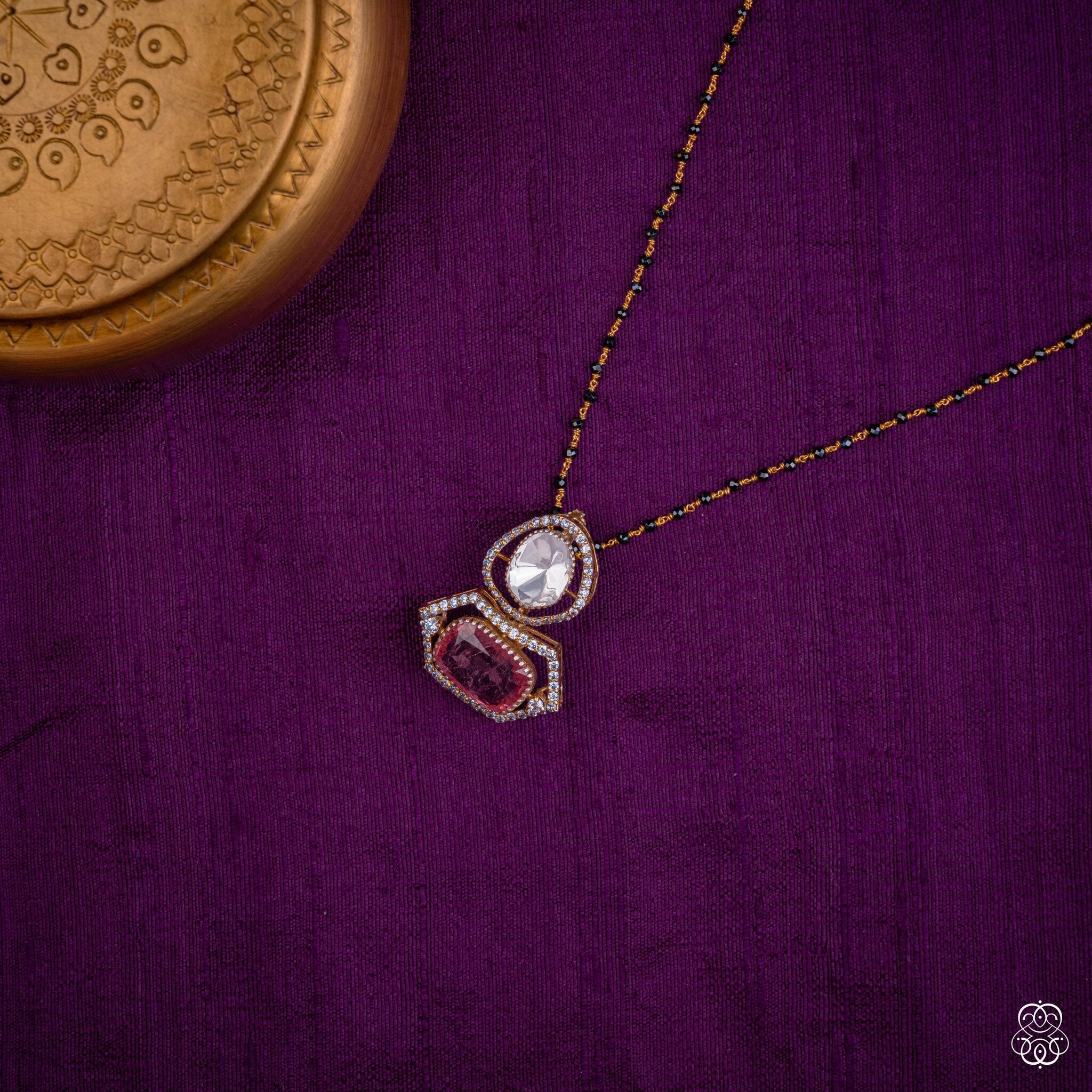 Raktakamala red tourmaline pendant styled on a black bead chain