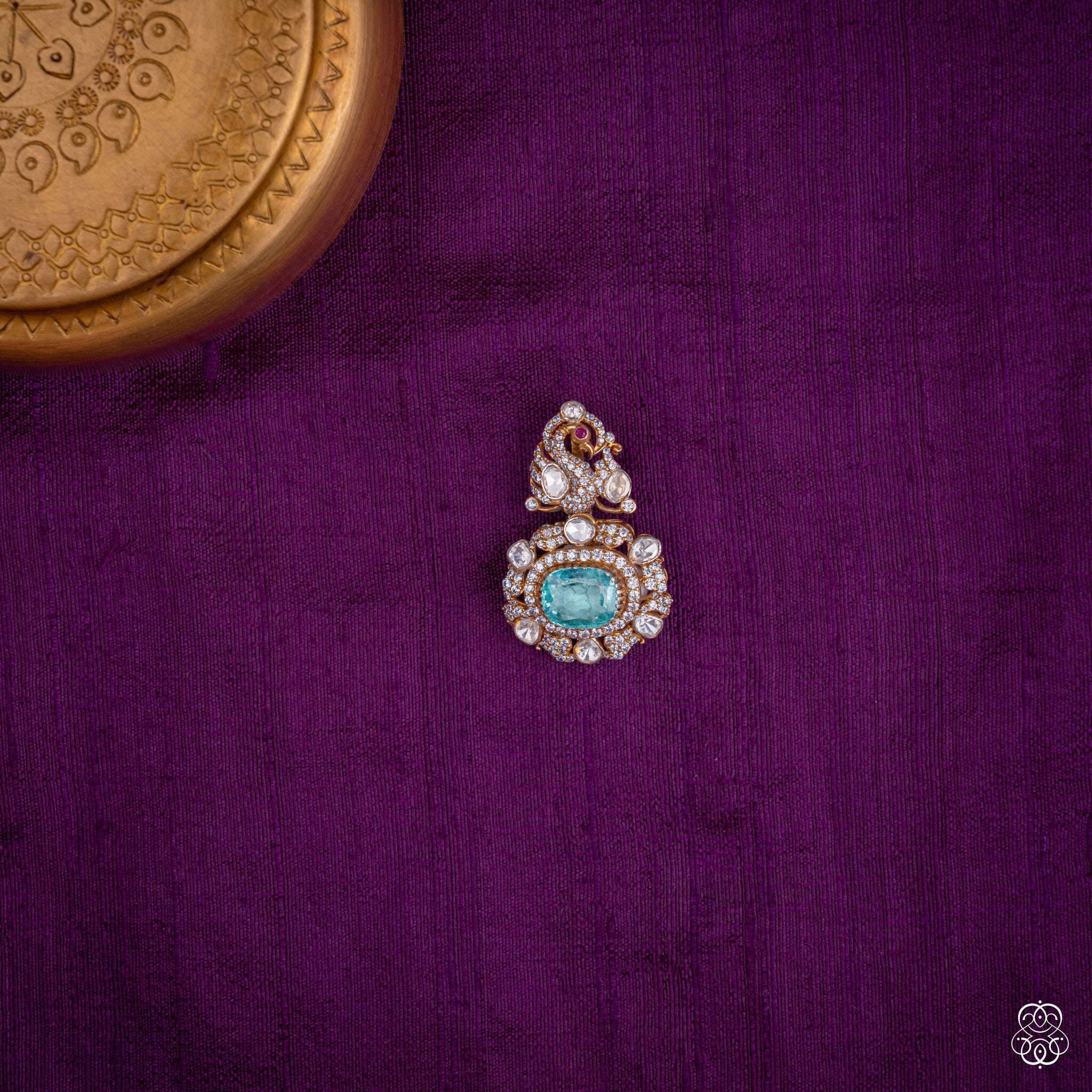 Shikhandini peacock pendant with an aqua lab-grown emerald and moissanites in 92.5 sterling silver with 22k gold plating