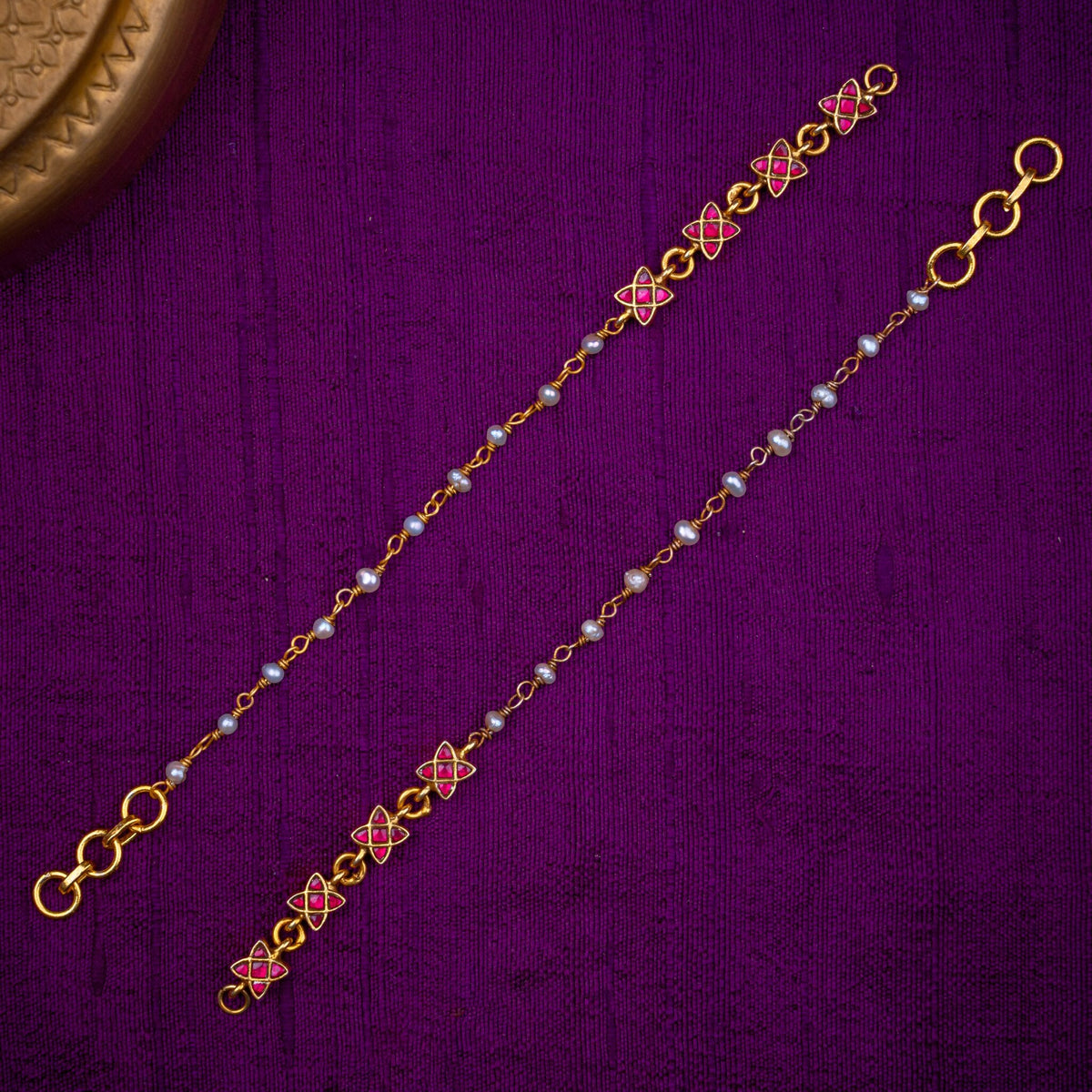 Taraka Matilu - minimal ear chains with star motifs, set with ruby kundan and fresh water pearls, in 92.5 sterling silver with 22k gold plating