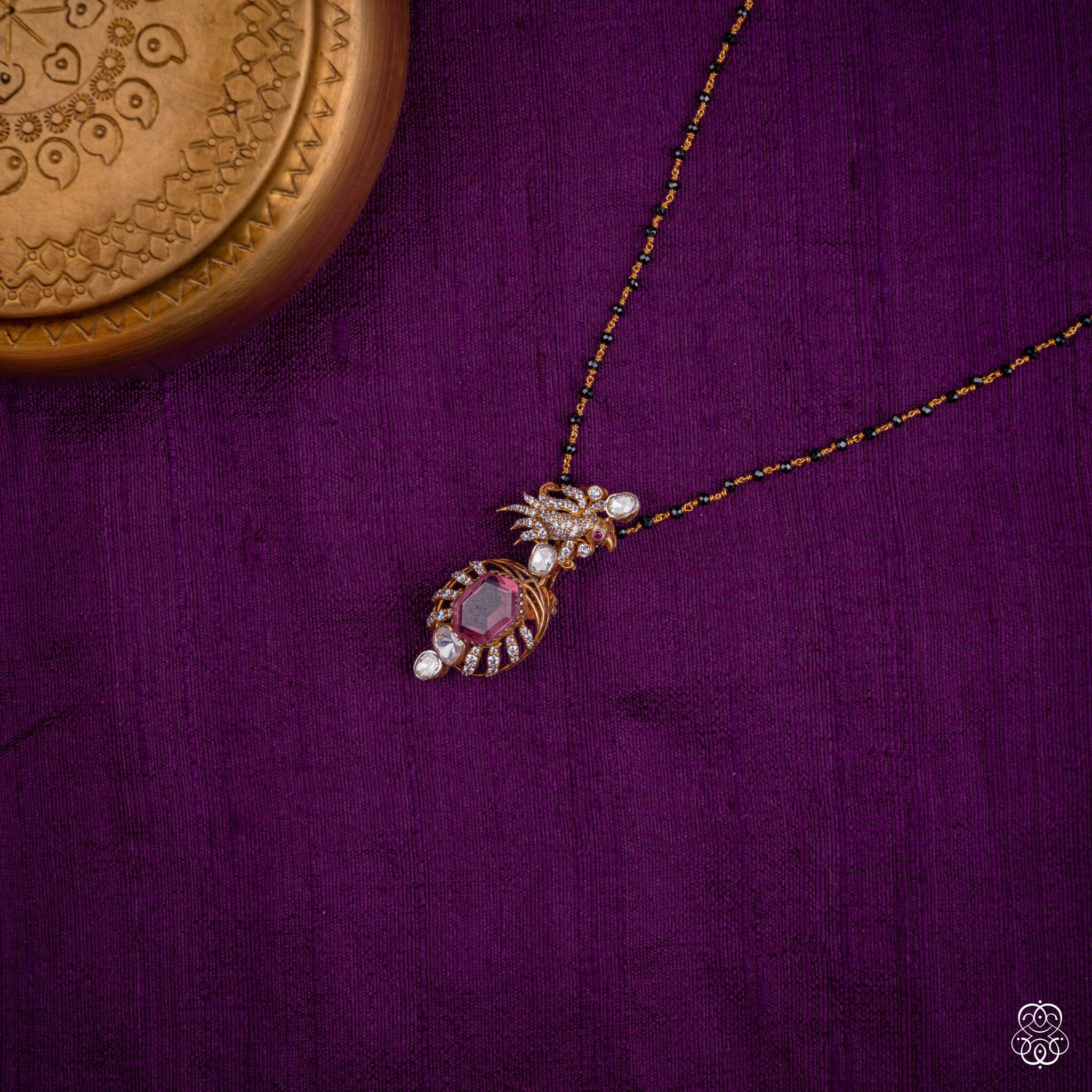 Aruna Pushpa pink tourmaline pendant styled on a black bead chain
