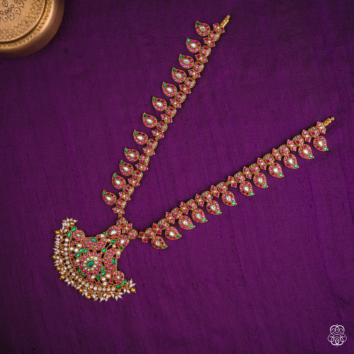 Close-up of the Ratnamayi mango haaram paisley pendant with pearl fringe in 92.5 sterling silver with 22k gold plating