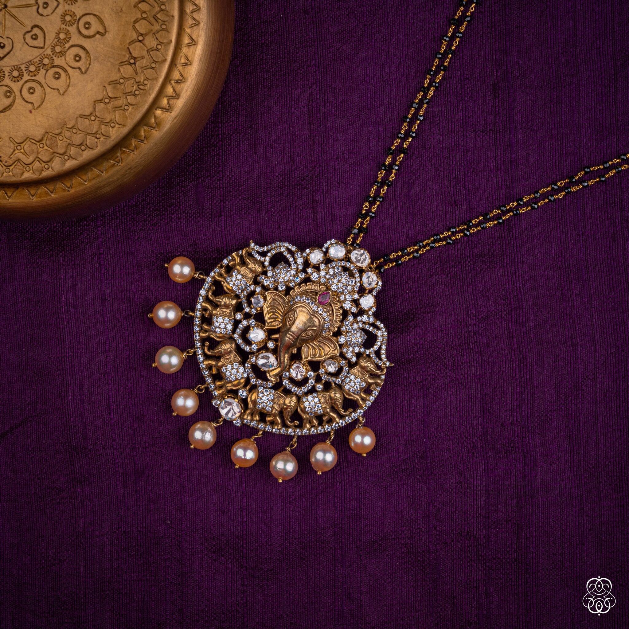 Ekadanta Ganesha pearl pendant styled on a black bead chain