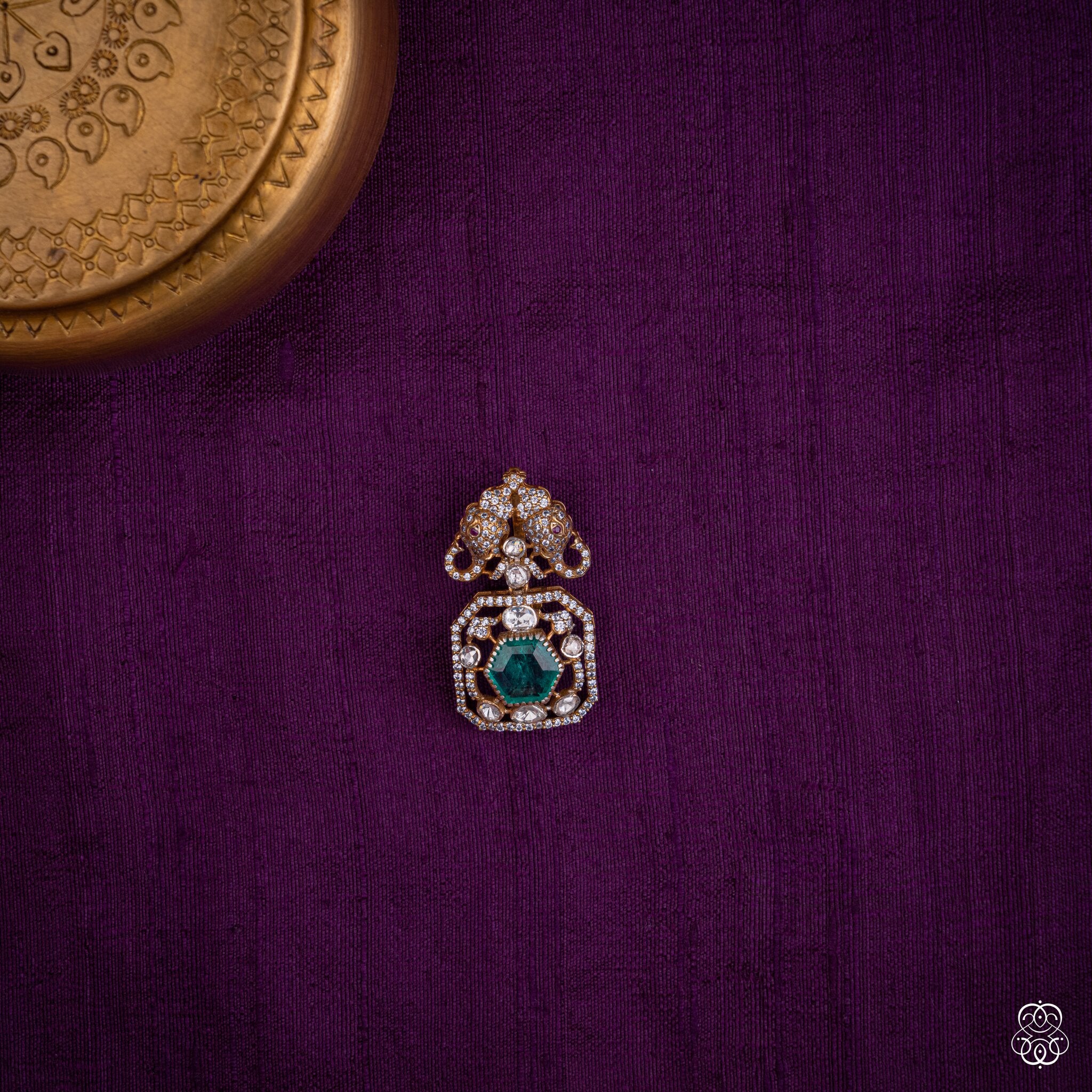 Gajayugma twin elephant pendant with a green lab-grown emerald and moissanites in 92.5 sterling silver with 22k gold plating