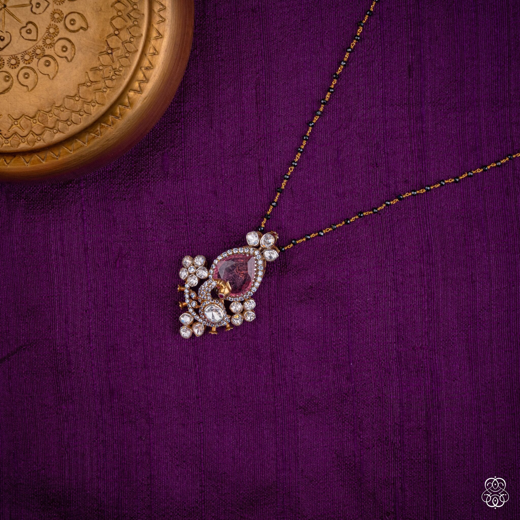 Gulabkali pink tourmaline pendant styled on a black bead chain