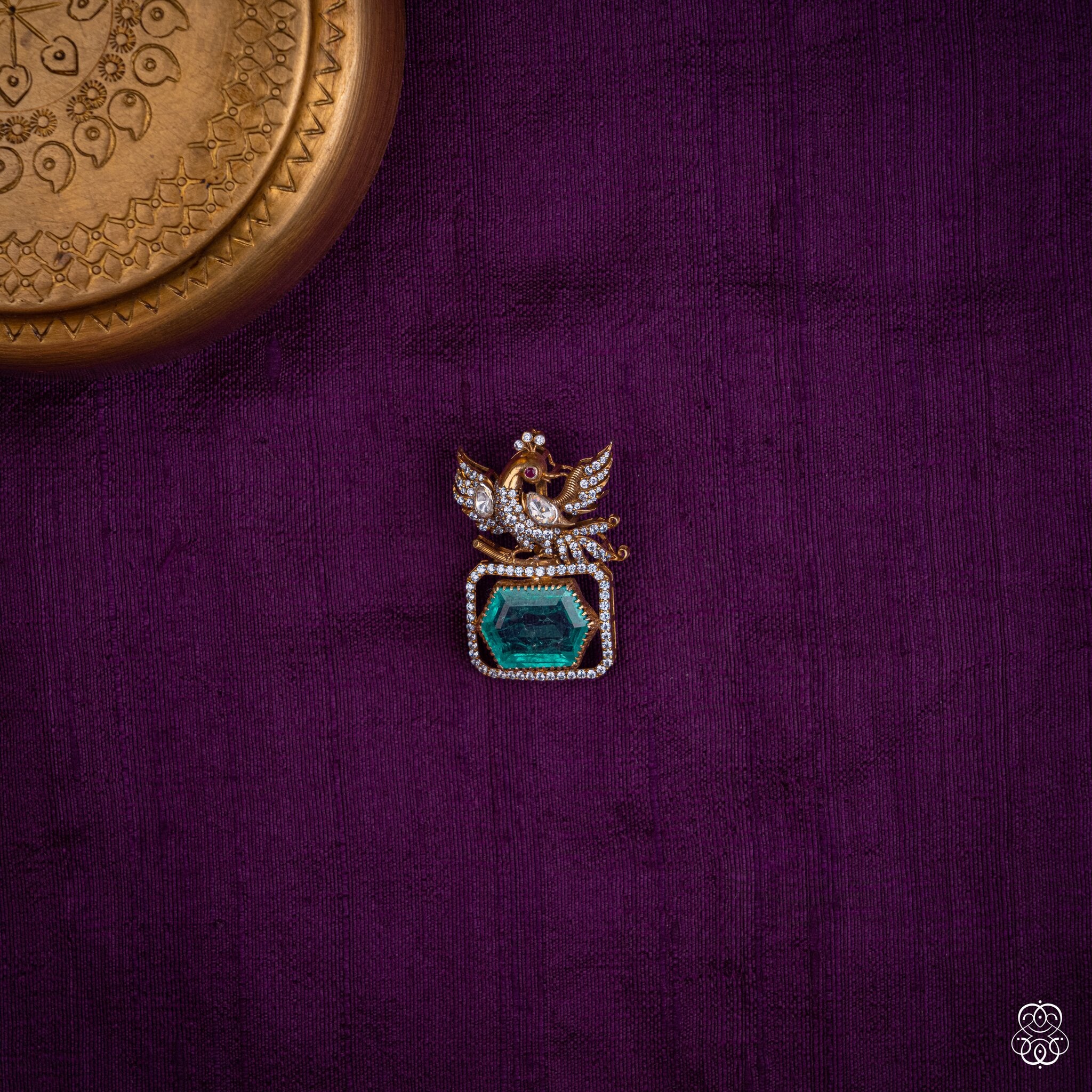 Hamsayugma twin swan pendant with a hexagonal lab-grown emerald and moissanites in 92.5 sterling silver with 22k gold plating