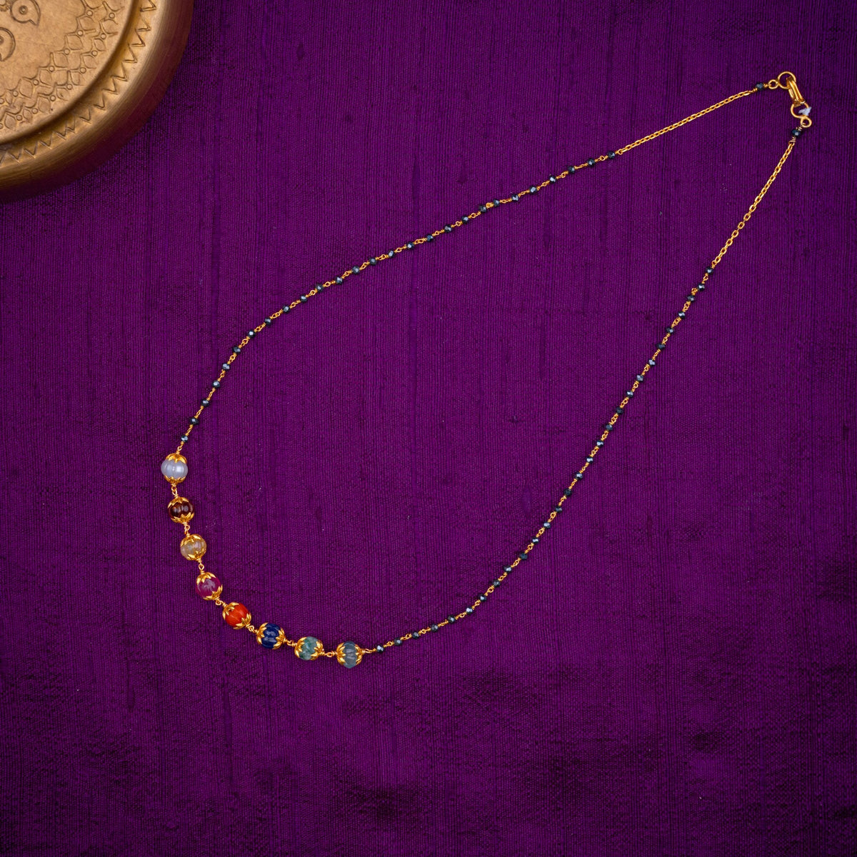 Navagraha Black Beads Chain - black beads chain with navaratna beads, set with carved navaratna beads, a fresh water pearl and black beads, in 92.5 sterling silver with 22k gold plating