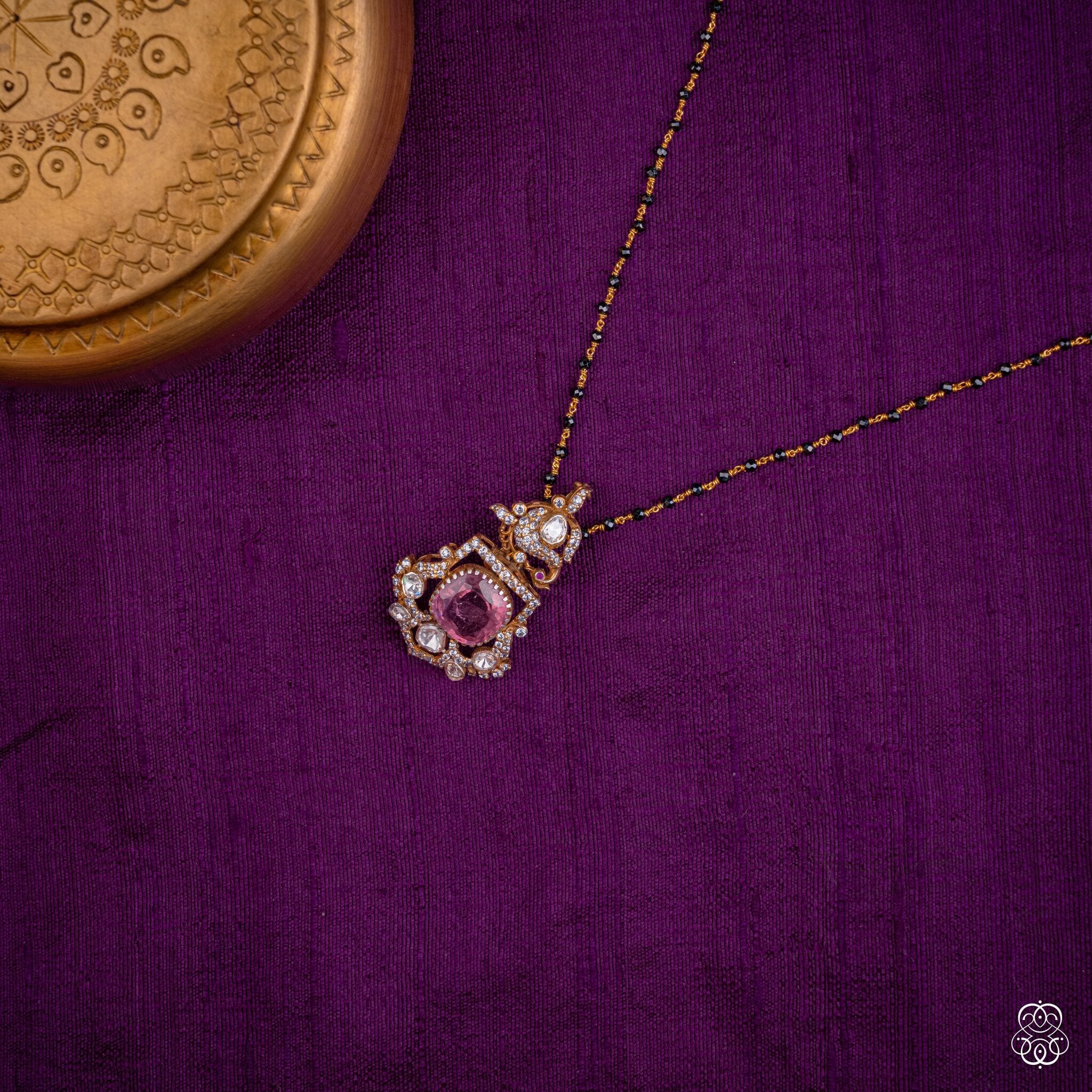 Ragamalika pink tourmaline pendant styled on a black bead chain