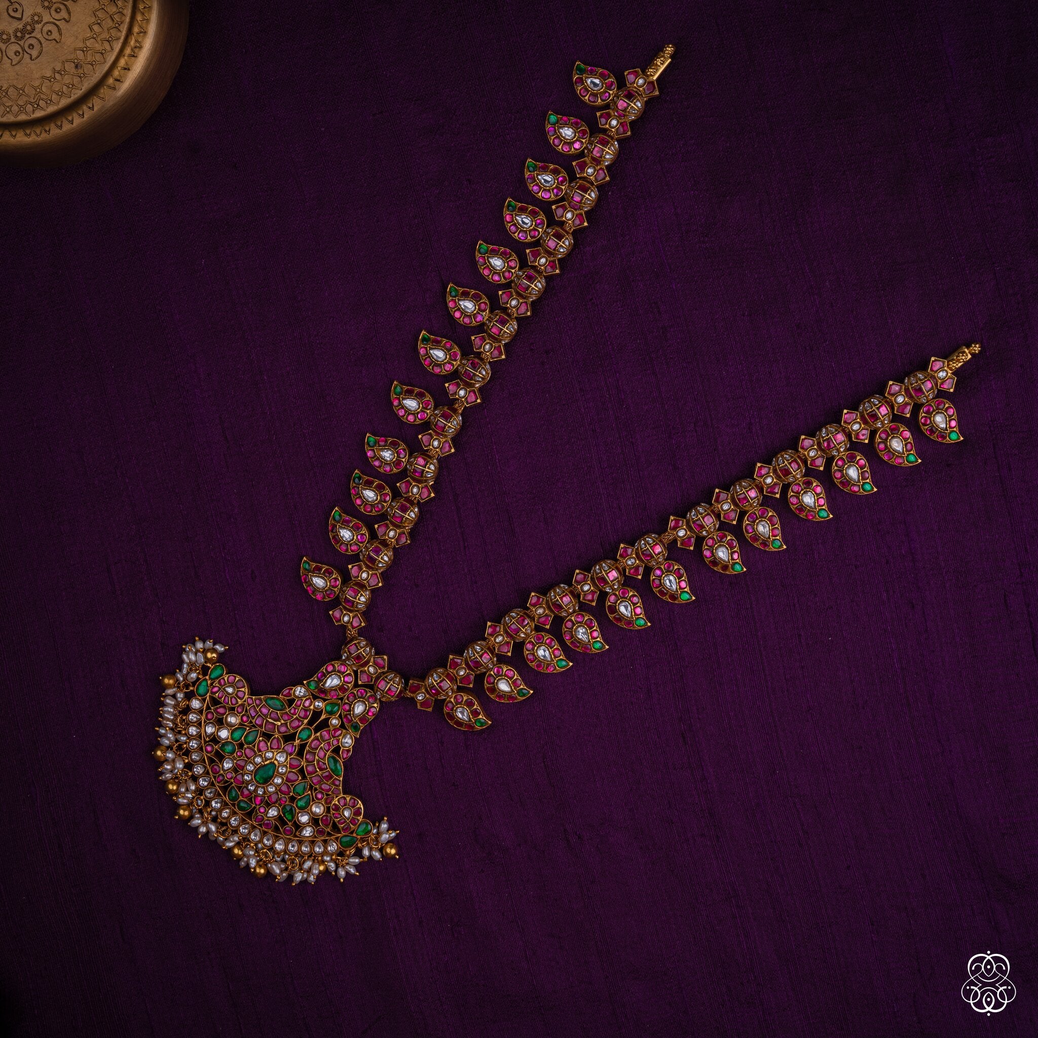 Close-up of the Ratnamayi mango haaram paisley pendant with pearl fringe in 92.5 sterling silver with 22k gold plating