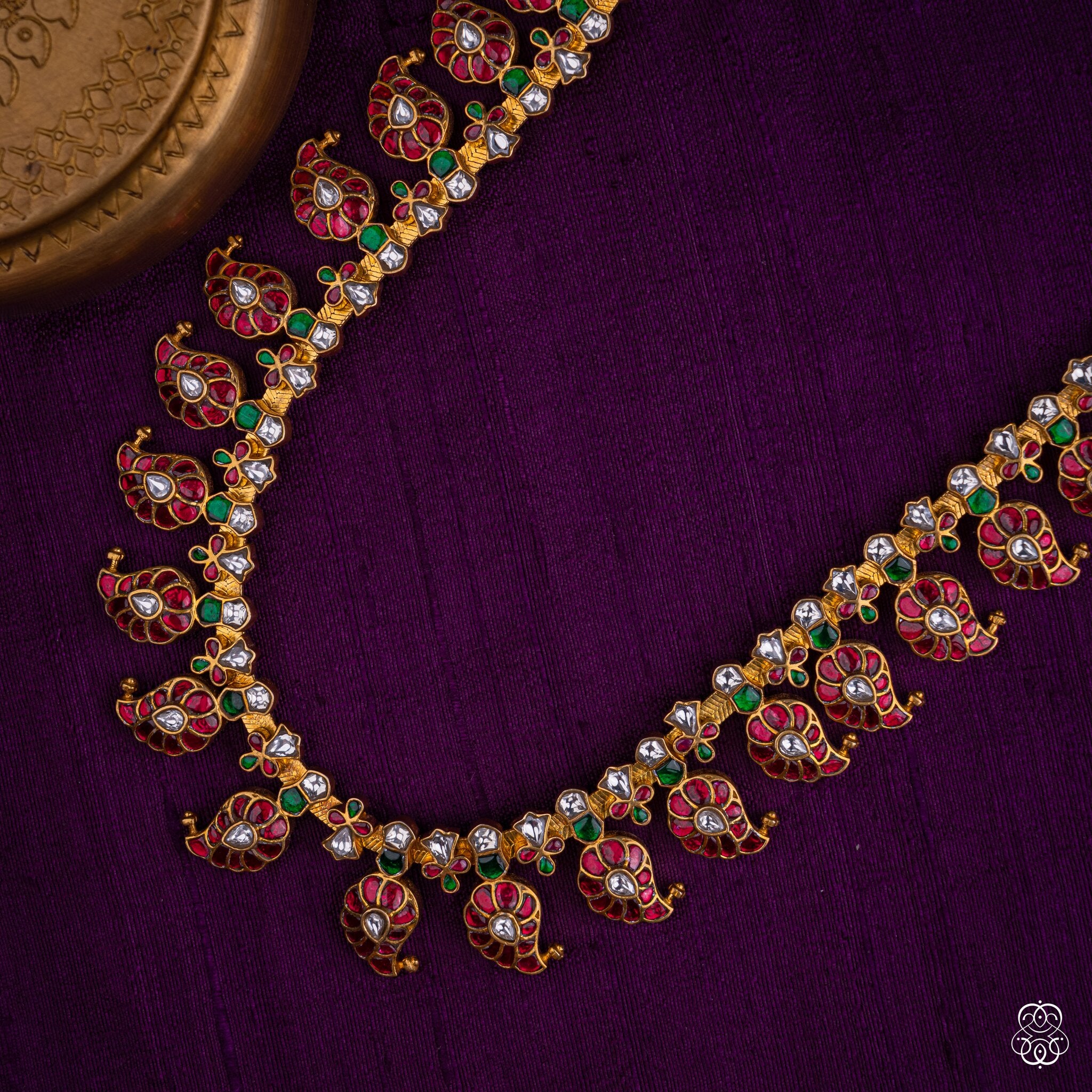Close-up of the Rukmini mango necklace ruby and moissanite motifs in 92.5 sterling silver with 22k gold plating