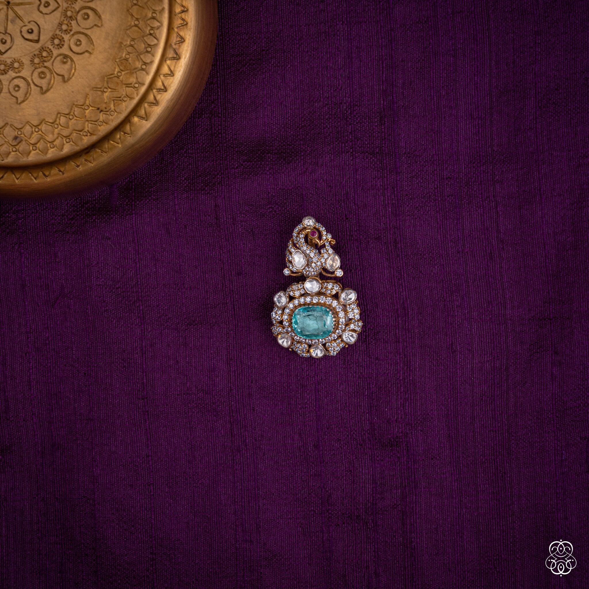 Shikhandini peacock pendant with an aqua lab-grown emerald and moissanites in 92.5 sterling silver with 22k gold plating