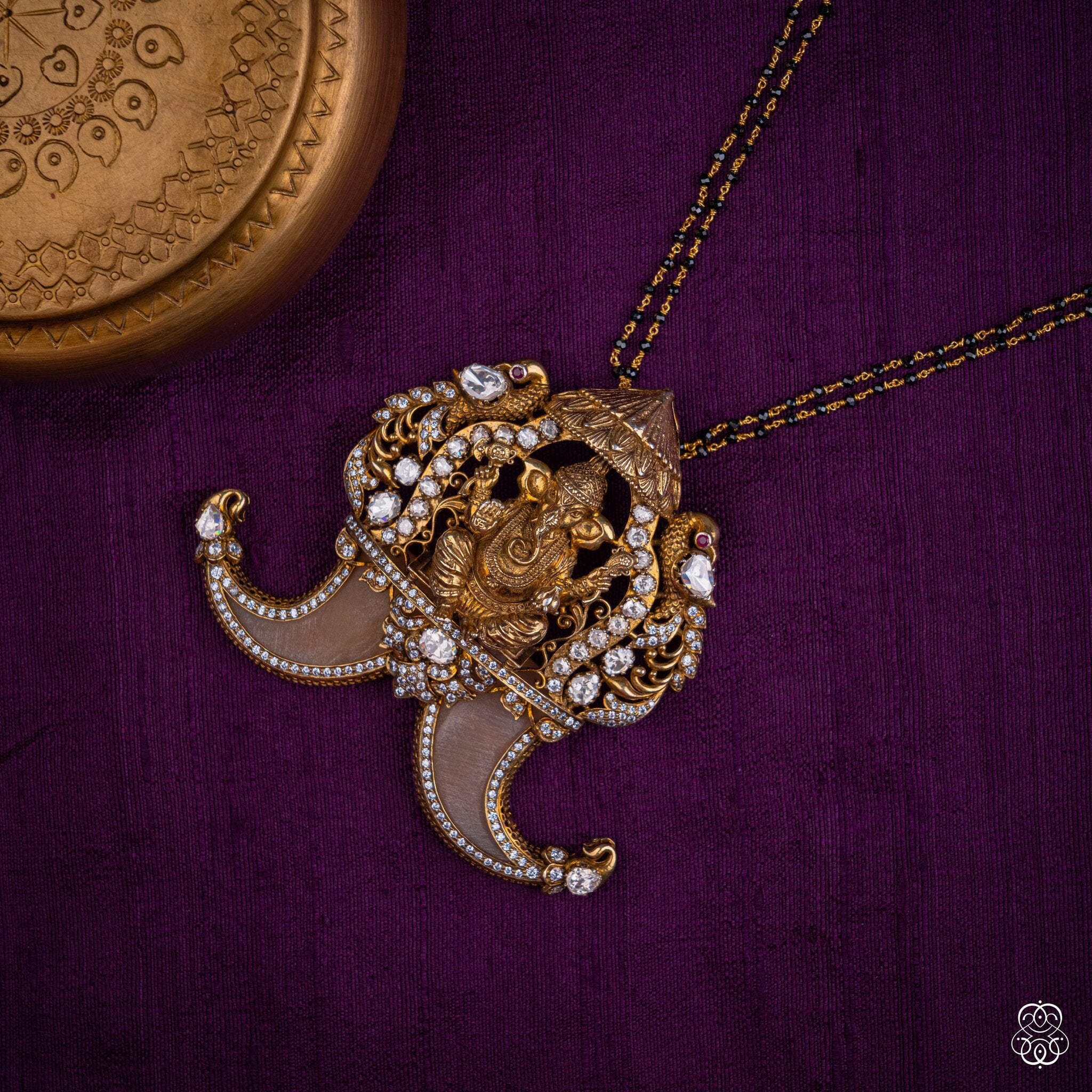 Siddhivinayaka Ganesha temple pendant styled on a black bead chain