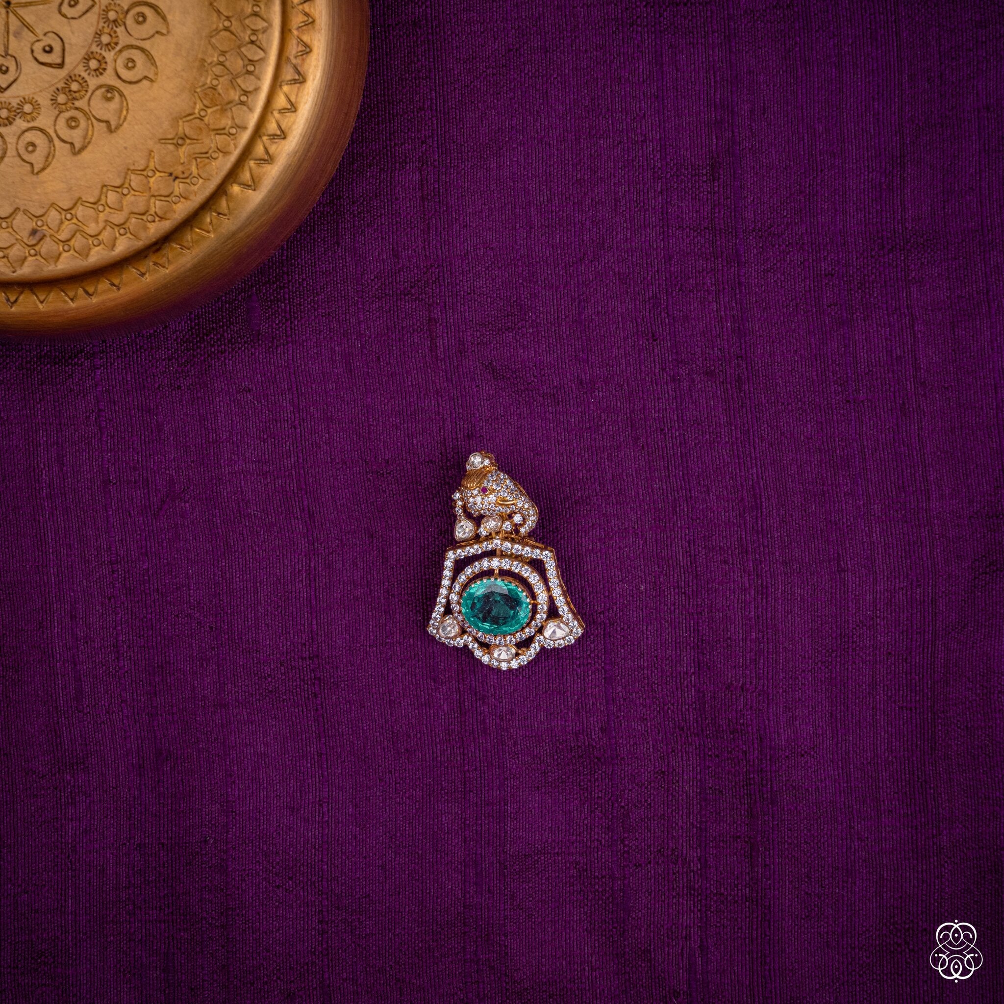 Suvarna Shuka parrot pendant with a lab-grown emerald and moissanites in 92.5 sterling silver with 22k gold plating