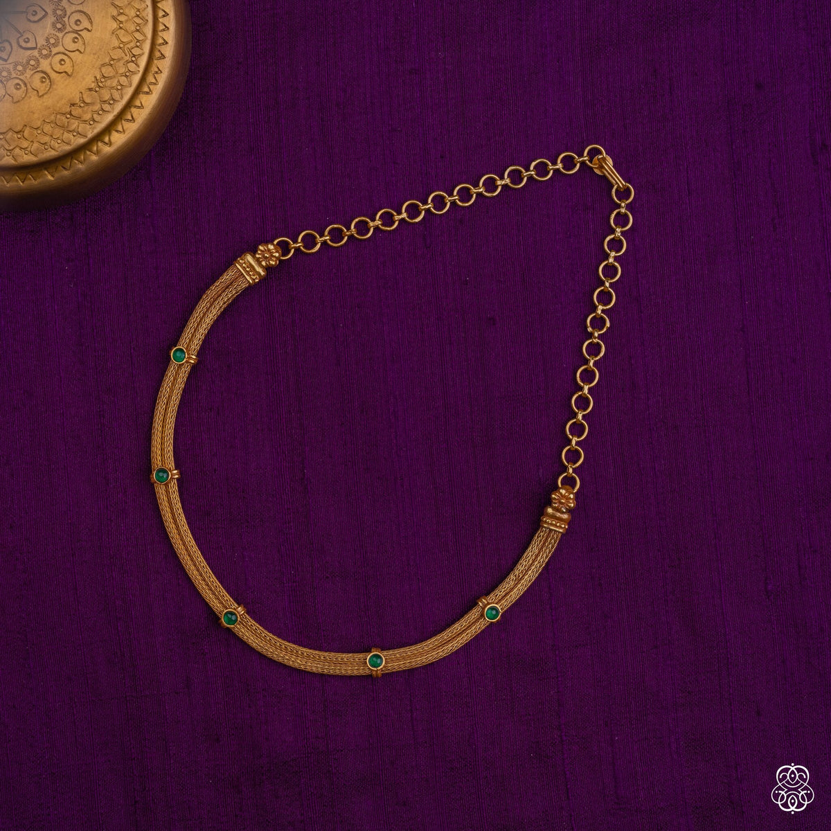 Venimala braided gold necklace with emerald stations in 92.5 sterling silver with 22k gold plating